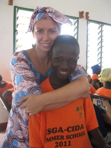 a canadian health volunteer and a Gambian student in Africa